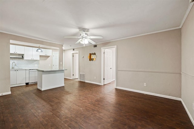 unfurnished living room featuring dark wood-type flooring, a ceiling fan, and visible vents