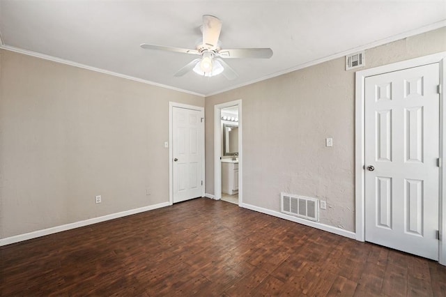 unfurnished bedroom featuring visible vents, ornamental molding, and hardwood / wood-style flooring