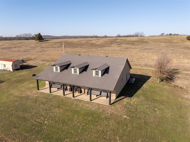 birds eye view of property with a rural view