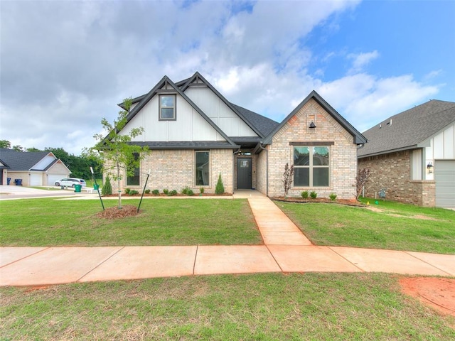 view of front of home with brick siding and a front lawn