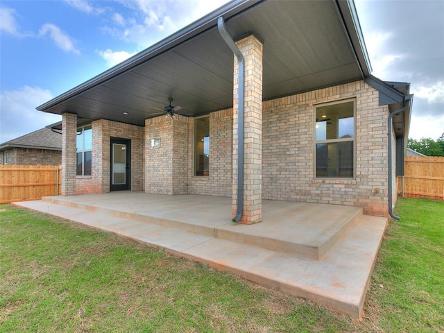 view of patio / terrace featuring fence and ceiling fan