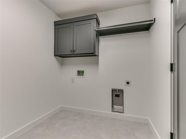 laundry area featuring baseboards, hookup for an electric dryer, washer hookup, and cabinet space