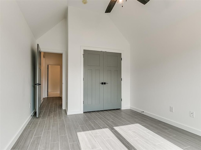 unfurnished bedroom featuring a closet, baseboards, and wood tiled floor