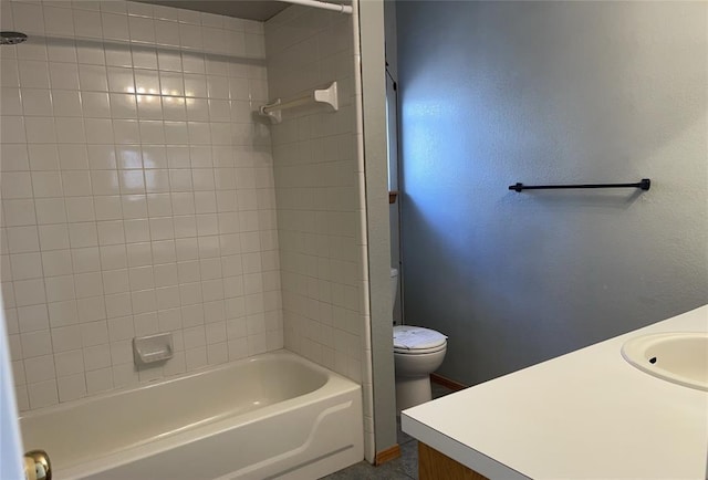 full bathroom with toilet, vanity, and shower / tub combination