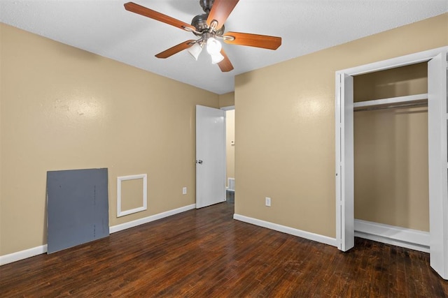 unfurnished bedroom featuring visible vents, a ceiling fan, hardwood / wood-style flooring, a closet, and baseboards