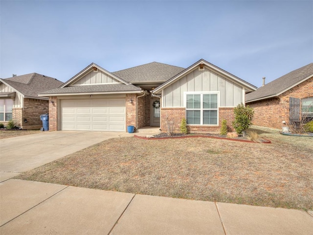 view of front of home with roof with shingles, concrete driveway, a garage, board and batten siding, and brick siding