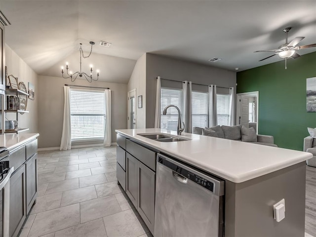 kitchen featuring visible vents, open floor plan, ceiling fan with notable chandelier, stainless steel dishwasher, and a sink