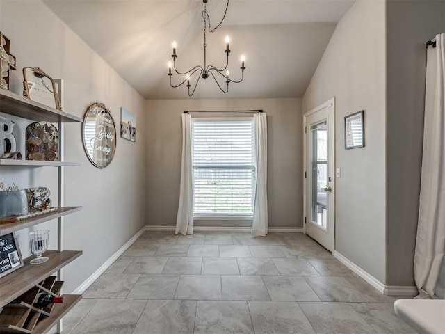 unfurnished dining area with baseboards, lofted ceiling, and a chandelier