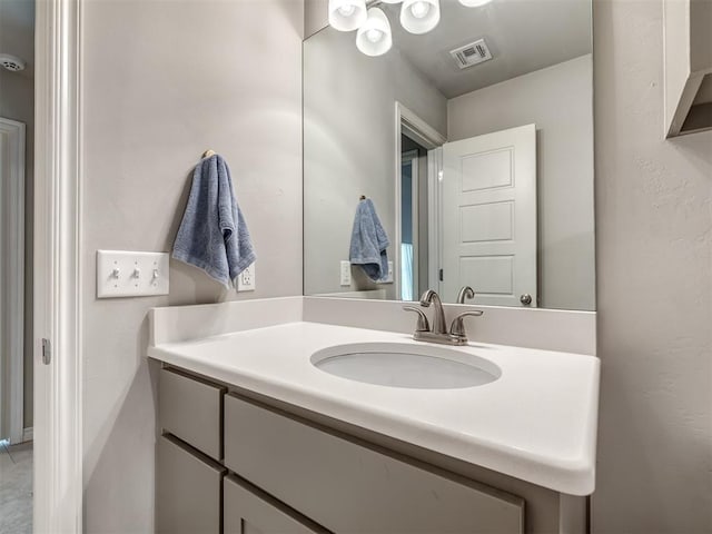 bathroom featuring vanity and visible vents