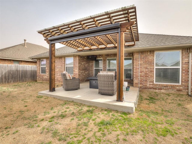 view of patio / terrace with a pergola and fence