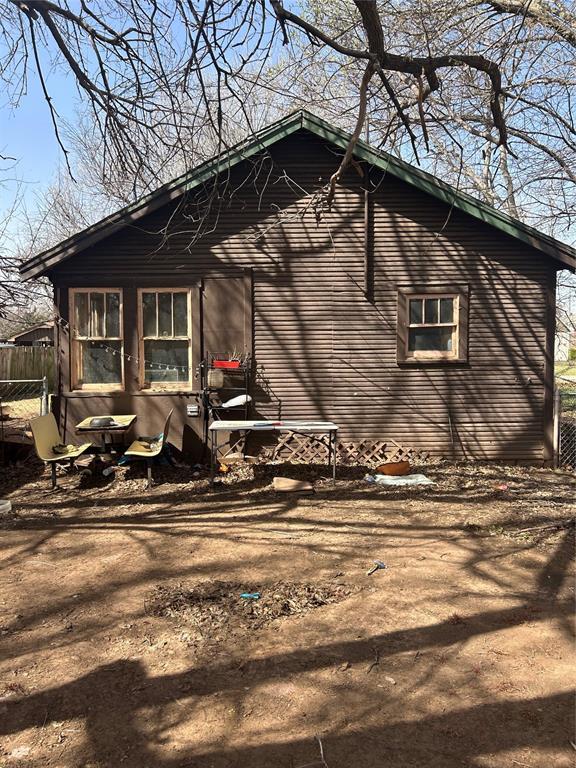 view of property exterior featuring fence