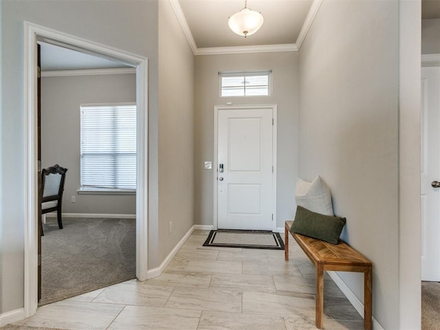 entryway with light carpet, baseboards, and ornamental molding