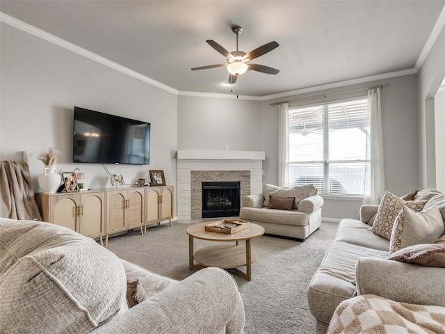 living room featuring ceiling fan, ornamental molding, and light carpet