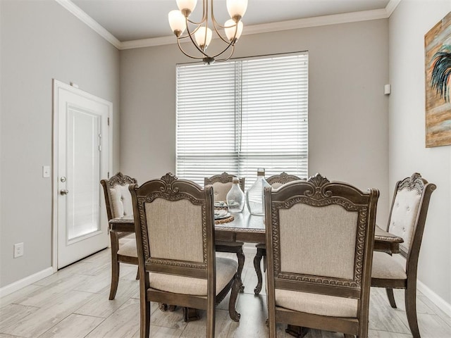 dining area featuring an inviting chandelier, crown molding, and baseboards