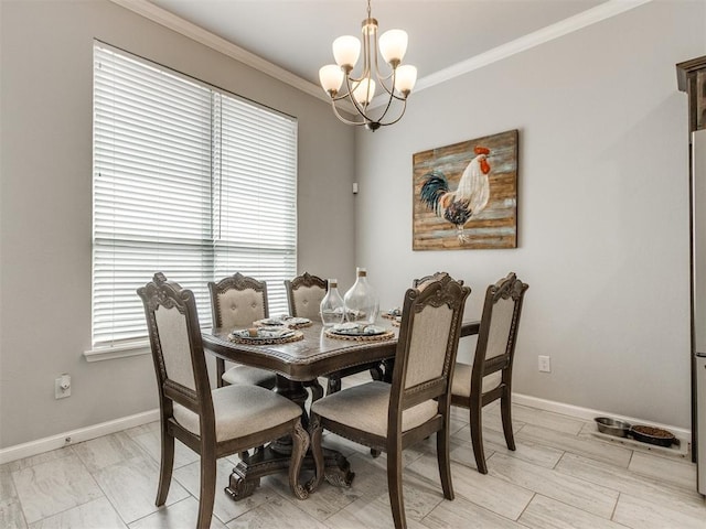 dining room featuring baseboards, an inviting chandelier, and crown molding