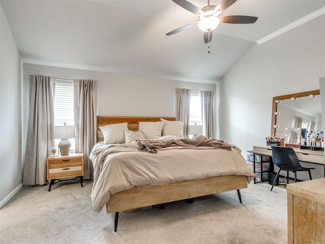 bedroom with lofted ceiling, a ceiling fan, baseboards, and light carpet