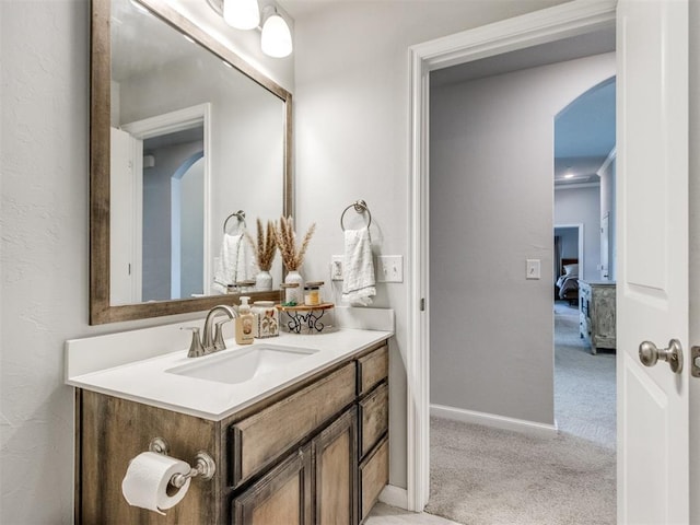 bathroom featuring vanity and baseboards