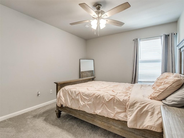 bedroom featuring baseboards, a ceiling fan, and carpet flooring