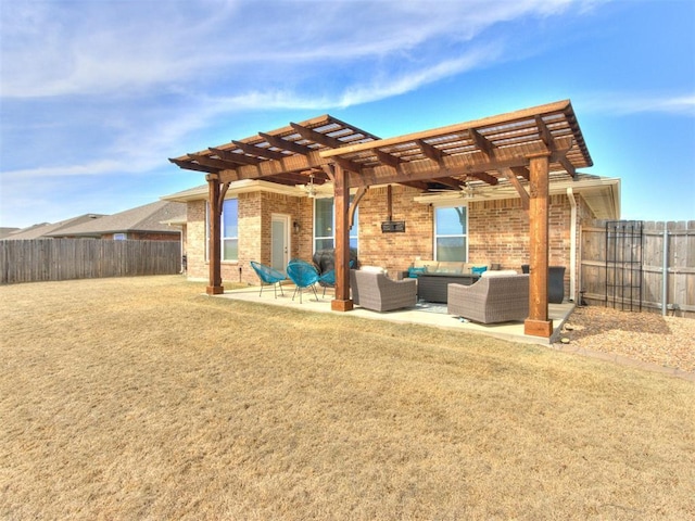 exterior space with fence, a pergola, outdoor lounge area, a patio area, and brick siding