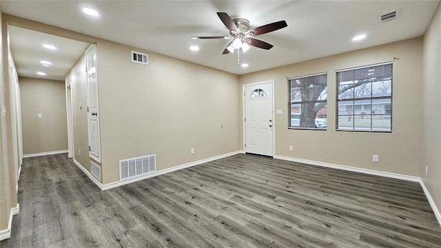 foyer entrance featuring wood finished floors, visible vents, and ceiling fan