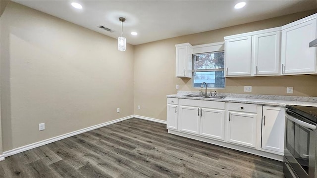 kitchen featuring baseboards, visible vents, dark wood finished floors, a sink, and electric stove