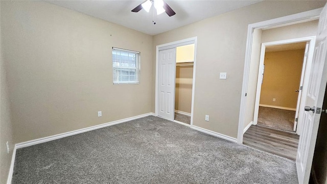 unfurnished bedroom featuring a closet, baseboards, ceiling fan, and carpet flooring