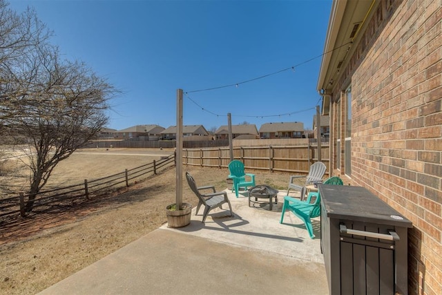 view of patio featuring a fire pit and a fenced backyard