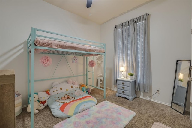 carpeted bedroom with baseboards and a ceiling fan