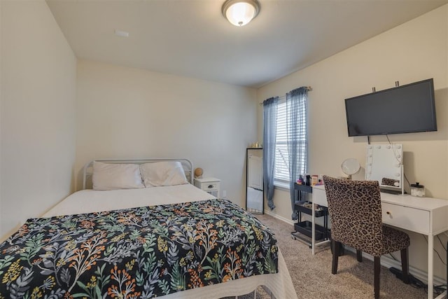 carpeted bedroom with baseboards