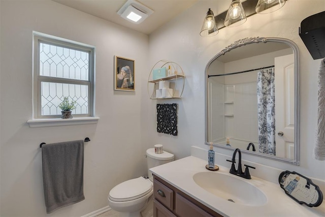 full bathroom with vanity, a shower with shower curtain, and toilet