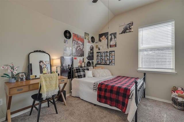 bedroom featuring baseboards, carpet floors, and lofted ceiling