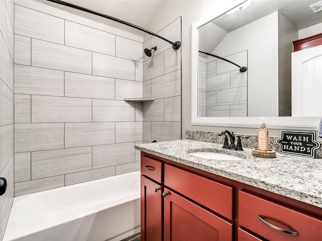 bathroom featuring visible vents, vanity, and  shower combination