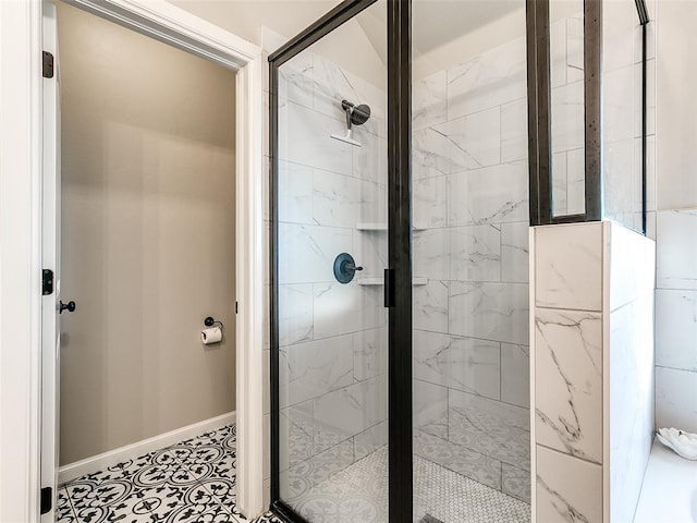 full bathroom with baseboards and a shower stall