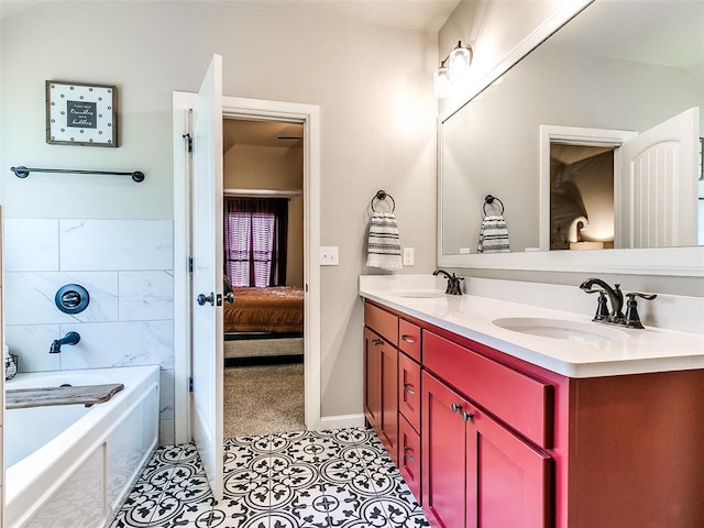 full bathroom featuring tile patterned flooring, double vanity, a bathing tub, and a sink