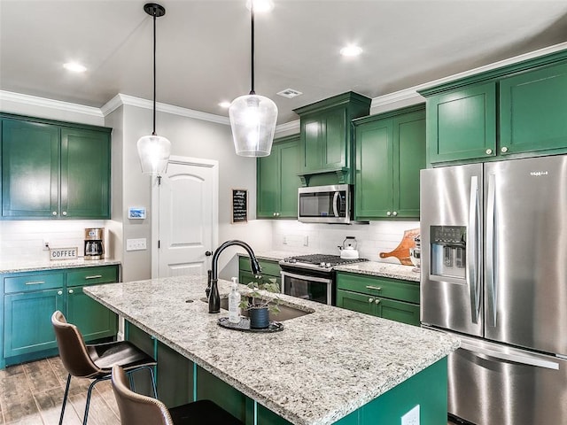 kitchen with visible vents, a sink, tasteful backsplash, appliances with stainless steel finishes, and crown molding