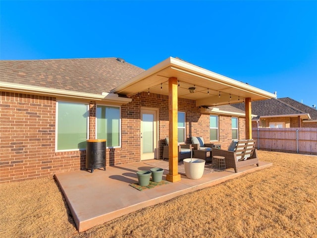 view of patio featuring an outdoor living space and fence