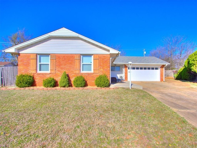 ranch-style house with brick siding, fence, concrete driveway, a front yard, and an attached garage