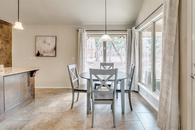 dining space featuring baseboards