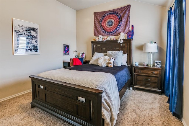 carpeted bedroom featuring baseboards