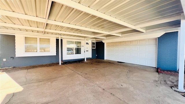 3731 Newport St, Oklahoma City, OK 73112 - doorway to property featuring brick siding, driveway, and a garage