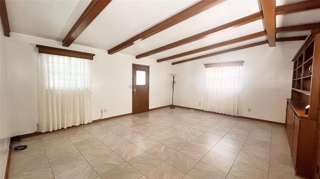 3731 Newport St, Oklahoma City, OK 73112 - spare room with vaulted ceiling with beams and baseboards