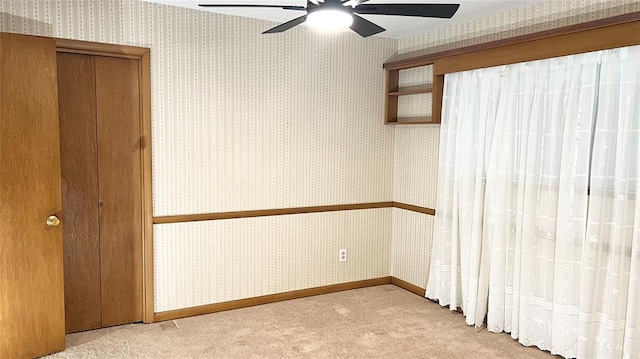 3731 Newport St, Oklahoma City, OK 73112 - spare room featuring a ceiling fan, wallpapered walls, carpet, and baseboards