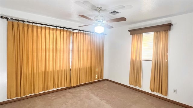 3731 Newport St, Oklahoma City, OK 73112 - carpeted empty room featuring a ceiling fan, baseboards, and visible vents