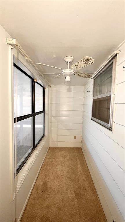 3731 Newport St, Oklahoma City, OK 73112 - empty room with light carpet and a ceiling fan