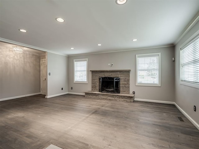 unfurnished living room with crown molding, visible vents, and a wealth of natural light