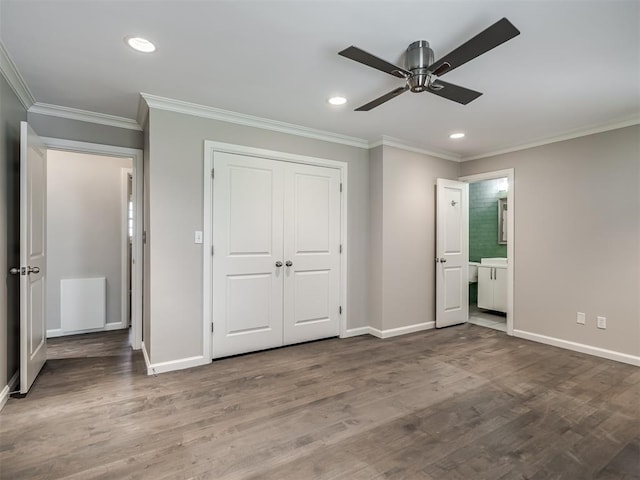 unfurnished bedroom featuring recessed lighting, baseboards, wood finished floors, and crown molding