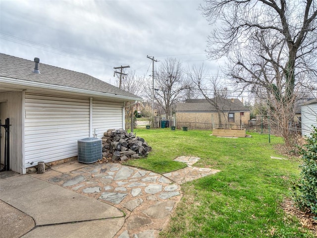 view of yard featuring cooling unit, a patio, and fence