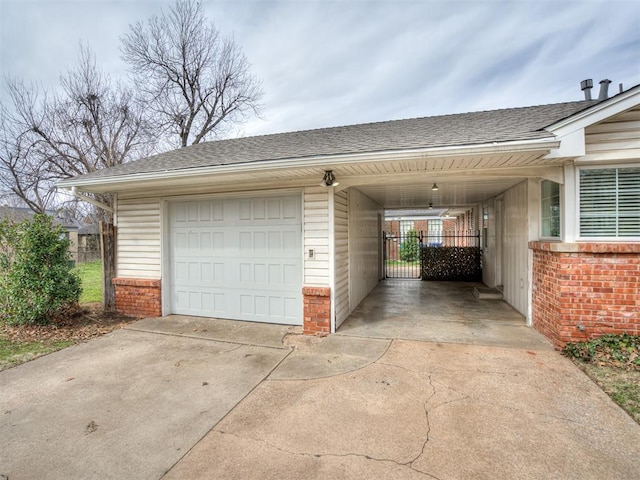 garage with concrete driveway