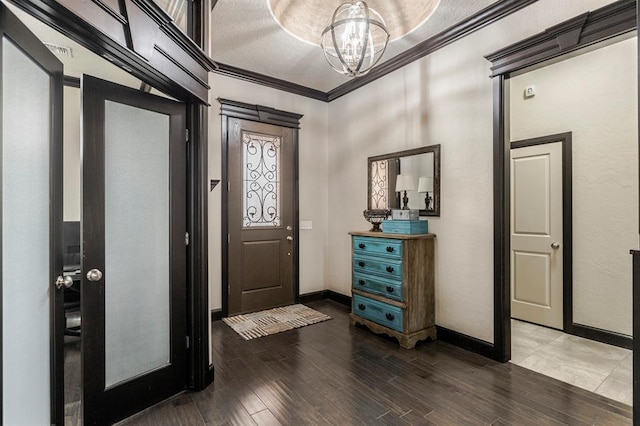 2241 W Mickey Dr, Mustang, OK 73064 - foyer entrance with wood finished floors, baseboards, and a chandelier