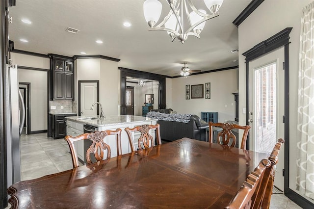 2241 W Mickey Dr, Mustang, OK 73064 - dining area featuring recessed lighting, crown molding, visible vents, and ceiling fan with notable chandelier